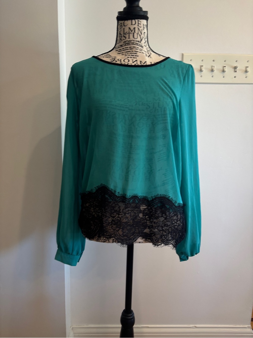 Romeo & Juliet Couture Teal Women's Top with Black Trim